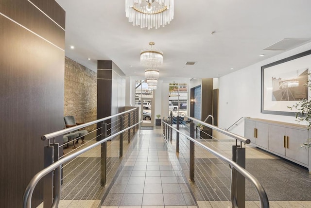 interior space with visible vents and an inviting chandelier
