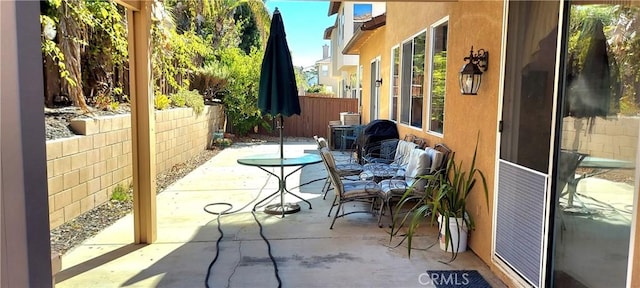 view of patio / terrace featuring outdoor dining area and a fenced backyard