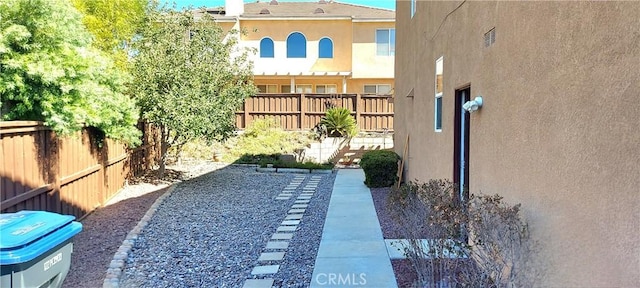 view of yard with a fenced backyard