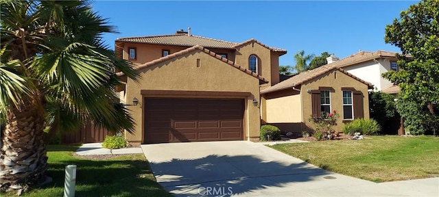 mediterranean / spanish-style home featuring concrete driveway, an attached garage, a tile roof, and stucco siding