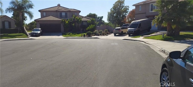 view of road with curbs, sidewalks, and a residential view