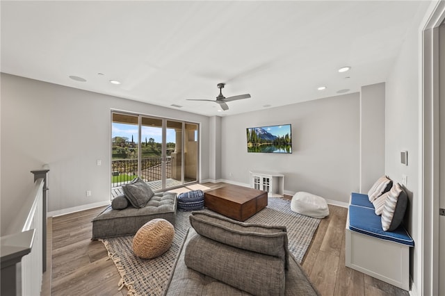 living room with ceiling fan, baseboards, wood finished floors, and recessed lighting