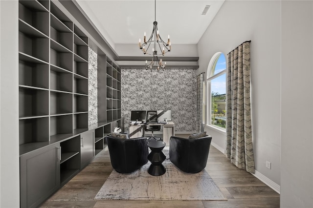 home office featuring dark wood-style floors, baseboards, visible vents, and a notable chandelier