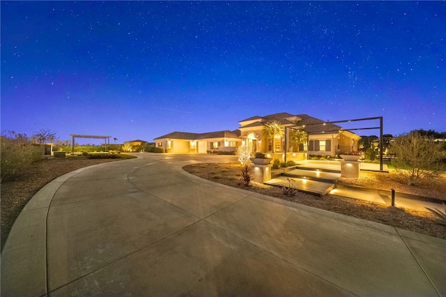 view of front of home featuring concrete driveway and an attached garage