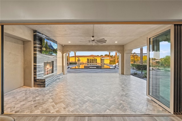 view of patio featuring a ceiling fan