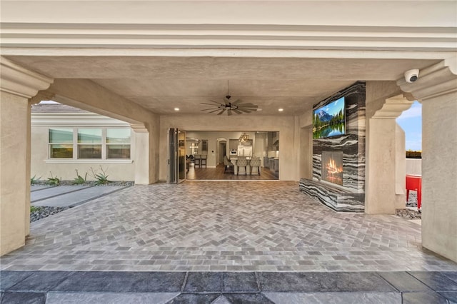 view of patio featuring a ceiling fan