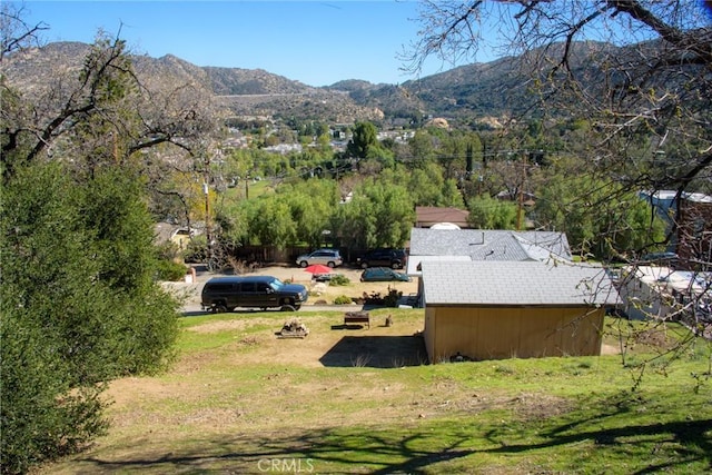 birds eye view of property with a mountain view