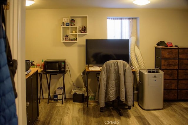 home office with wood finished floors