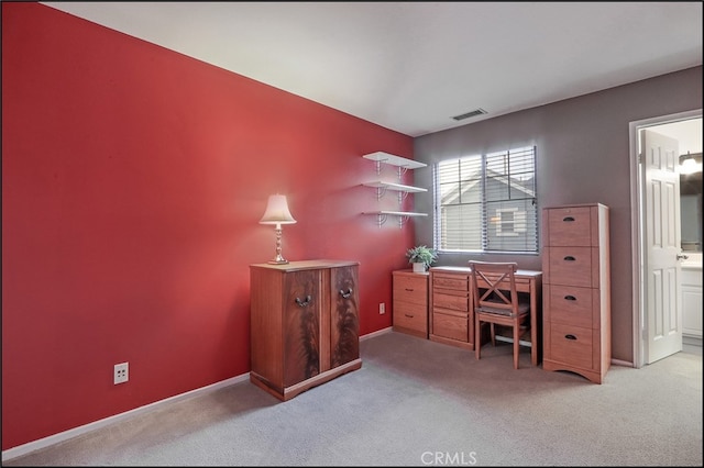 office with carpet floors, visible vents, and baseboards