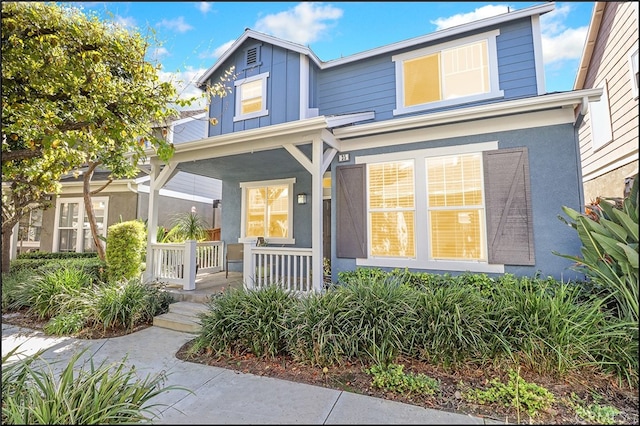 view of front of home with board and batten siding and a porch