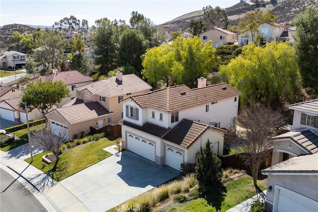 aerial view featuring a mountain view and a residential view