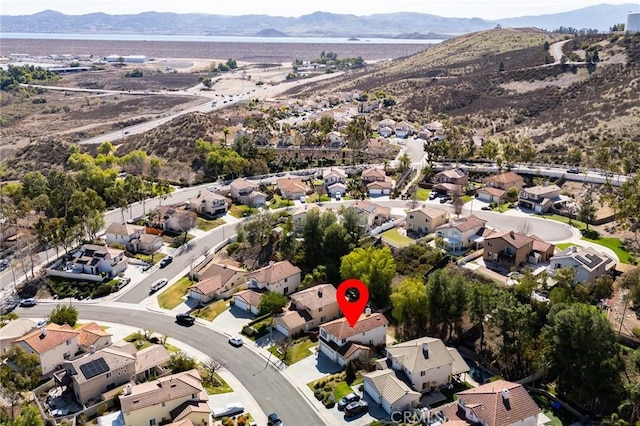 birds eye view of property with a residential view and a mountain view