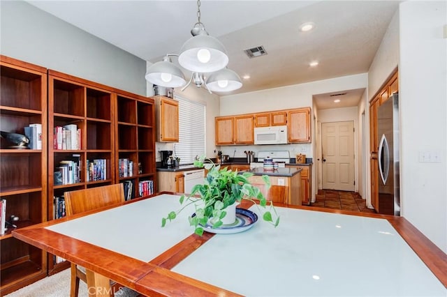 dining area featuring visible vents and recessed lighting