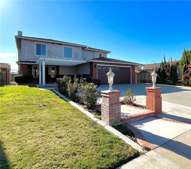 traditional-style home featuring a garage, driveway, and a front yard