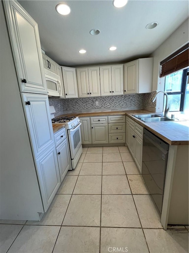 3570 Gettysburg Dr, Riverside, CA 92503 - kitchen featuring light tile patterned floors, recessed lighting, white appliances, a sink, and backsplash