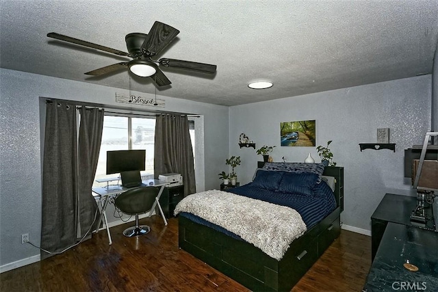 bedroom featuring baseboards, dark wood finished floors, a textured ceiling, and a textured wall