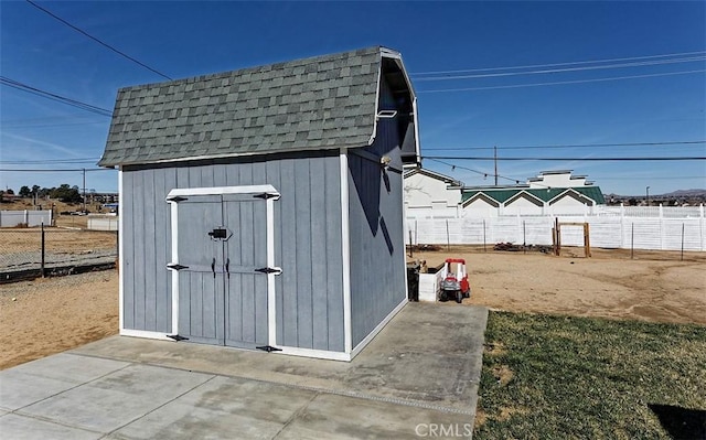 view of shed featuring a fenced backyard