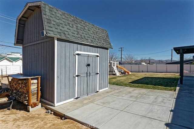 view of shed with fence