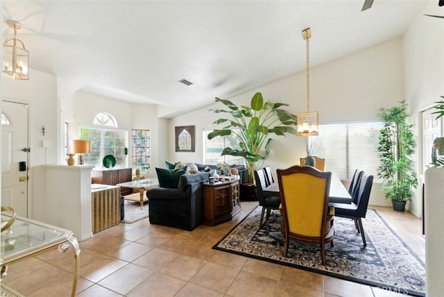 68820 San Felipe Rd, Cathedral City, CA 92234 - dining space with a chandelier, light tile patterned flooring, and high vaulted ceiling