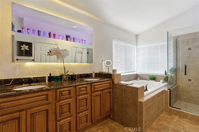 68820 San Felipe Rd, Cathedral City, CA 92234 - full bath featuring a garden tub, a shower stall, double vanity, vaulted ceiling, and tile patterned flooring