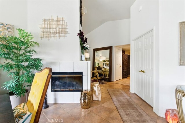 68820 San Felipe Rd, Cathedral City, CA 92234 - foyer entrance with a tiled fireplace, tile patterned flooring, and high vaulted ceiling