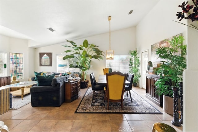 68820 San Felipe Rd, Cathedral City, CA 92234 - dining area featuring light tile patterned floors, a chandelier, and high vaulted ceiling