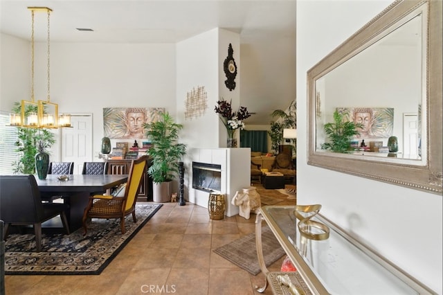 68820 San Felipe Rd, Cathedral City, CA 92234 - tiled dining room featuring a chandelier and a tiled fireplace