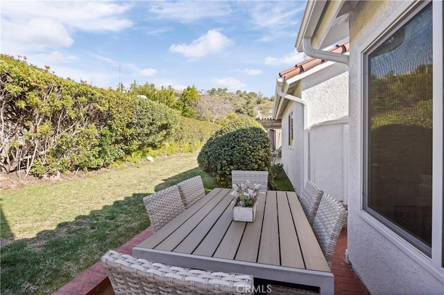 view of yard with outdoor dining area