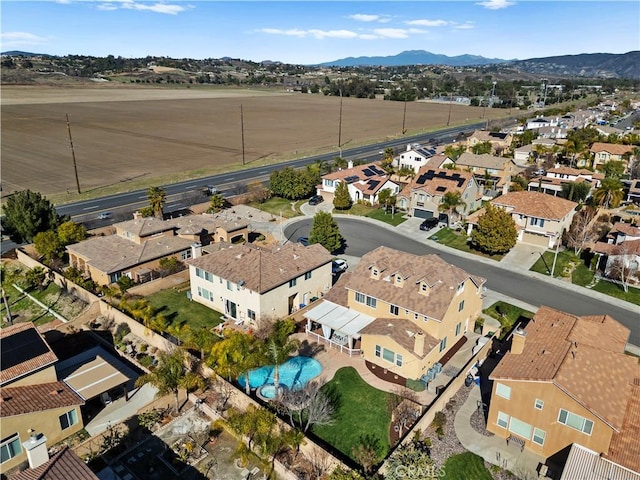 birds eye view of property featuring a mountain view and a residential view