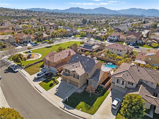 birds eye view of property with a residential view and a mountain view