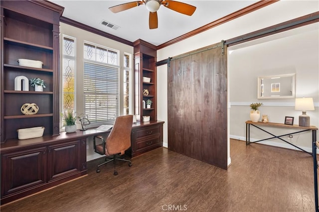 office area featuring dark wood finished floors, crown molding, visible vents, a barn door, and a ceiling fan