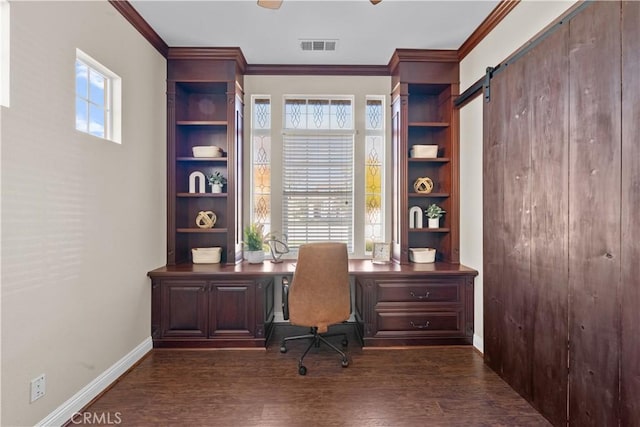 office with a barn door, baseboards, dark wood finished floors, and crown molding