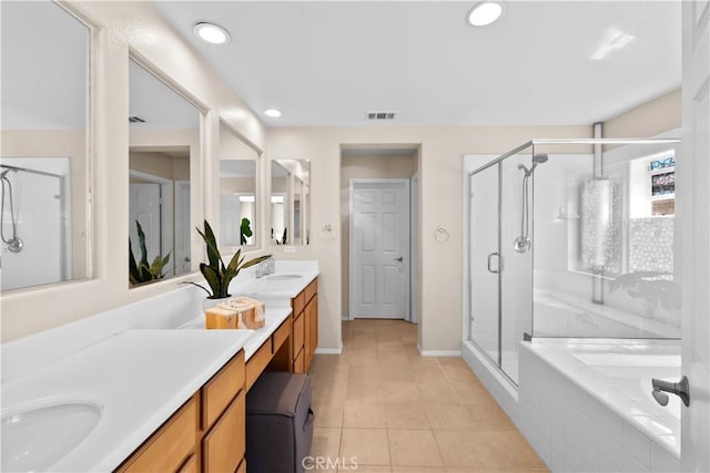 bathroom featuring double vanity, tile patterned floors, visible vents, a stall shower, and a bath