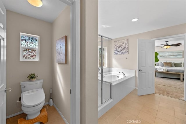 bathroom with a garden tub, toilet, connected bathroom, tile patterned flooring, and baseboards