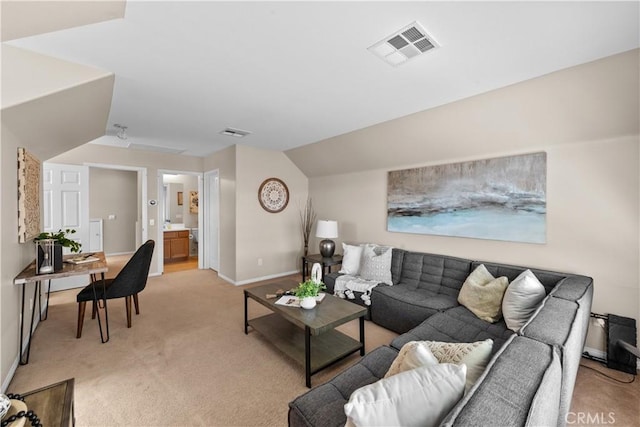 living room with light carpet, baseboards, visible vents, and lofted ceiling