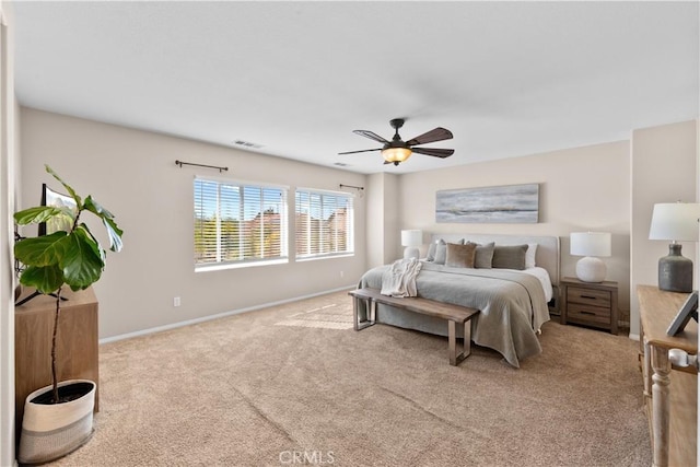 bedroom with ceiling fan, carpet floors, visible vents, and baseboards