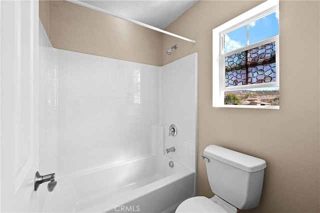 full bathroom featuring shower / bath combination, plenty of natural light, and toilet