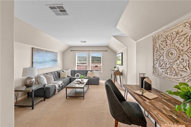 living room with light carpet, visible vents, and lofted ceiling