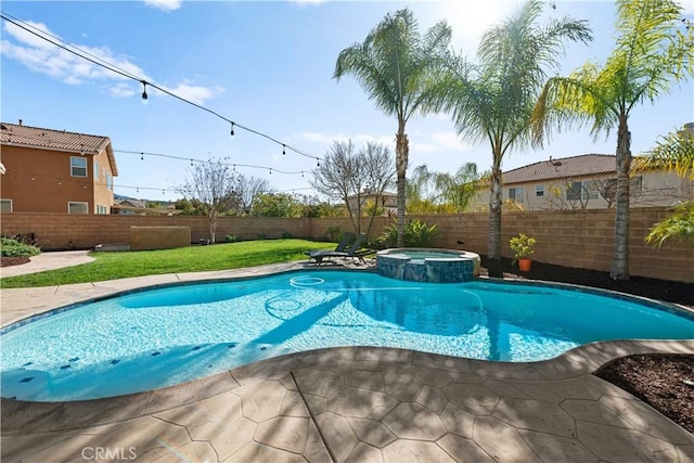 view of pool featuring a fenced backyard, a pool with connected hot tub, and a patio