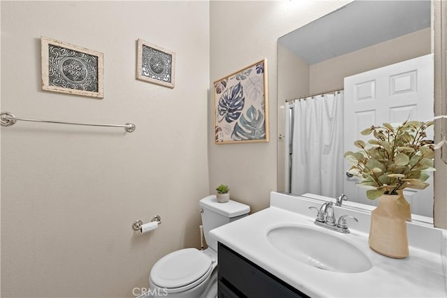 full bath featuring curtained shower, vanity, and toilet