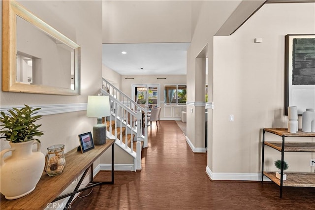 corridor featuring stairway, recessed lighting, wood finished floors, and baseboards