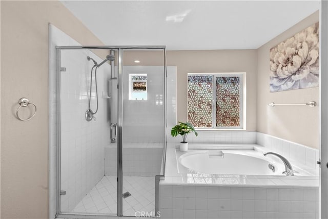 full bath featuring a shower stall and a bath