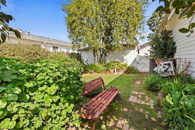 view of yard featuring fence and a gate