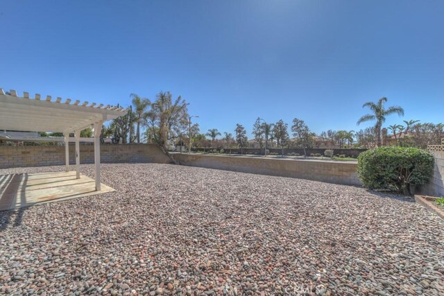 8371 Hawthorne St, Rancho Cucamonga, CA 91701 - fenced backyard with a pergola and a patio area