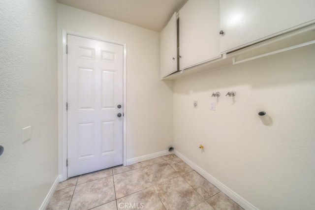 8371 Hawthorne St, Rancho Cucamonga, CA 91701 - laundry area with cabinet space, hookup for a gas dryer, and light tile patterned floors