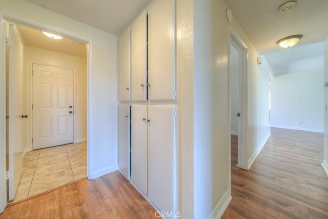 8371 Hawthorne St, Rancho Cucamonga, CA 91701 - corridor featuring light wood-style floors and baseboards
