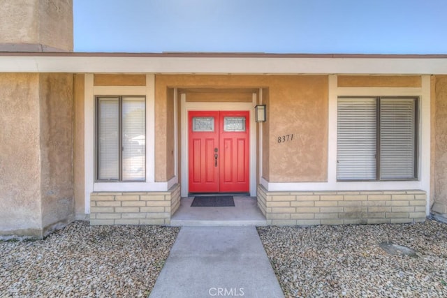 8371 Hawthorne St, Rancho Cucamonga, CA 91701 - doorway to property with stucco siding