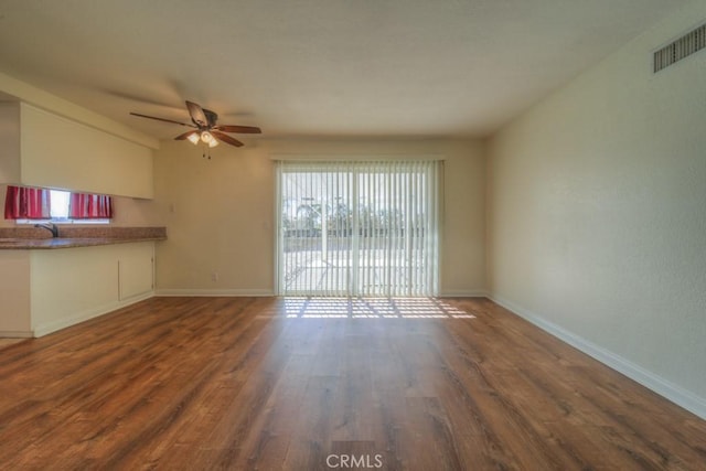 8371 Hawthorne St, Rancho Cucamonga, CA 91701 - unfurnished living room with wood finished floors and ceiling fan