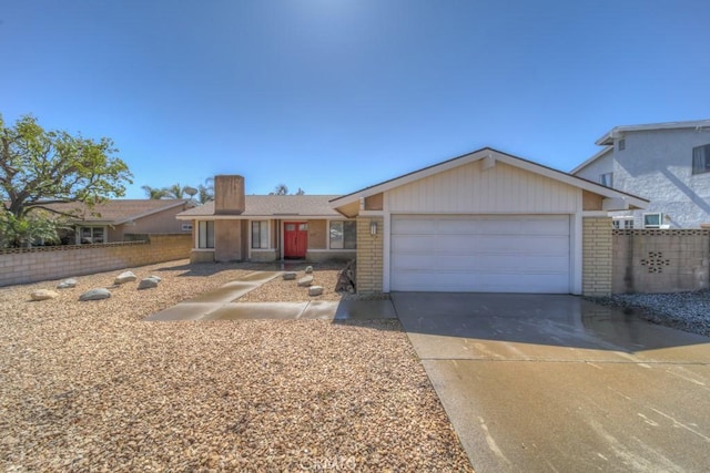 8371 Hawthorne St, Rancho Cucamonga, CA 91701 - ranch-style house with brick siding, an attached garage, driveway, and a chimney
