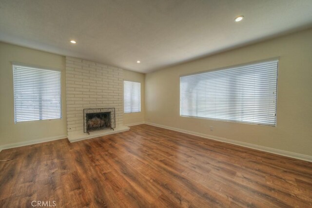 8371 Hawthorne St, Rancho Cucamonga, CA 91701 - unfurnished living room featuring wood finished floors, a fireplace, and recessed lighting